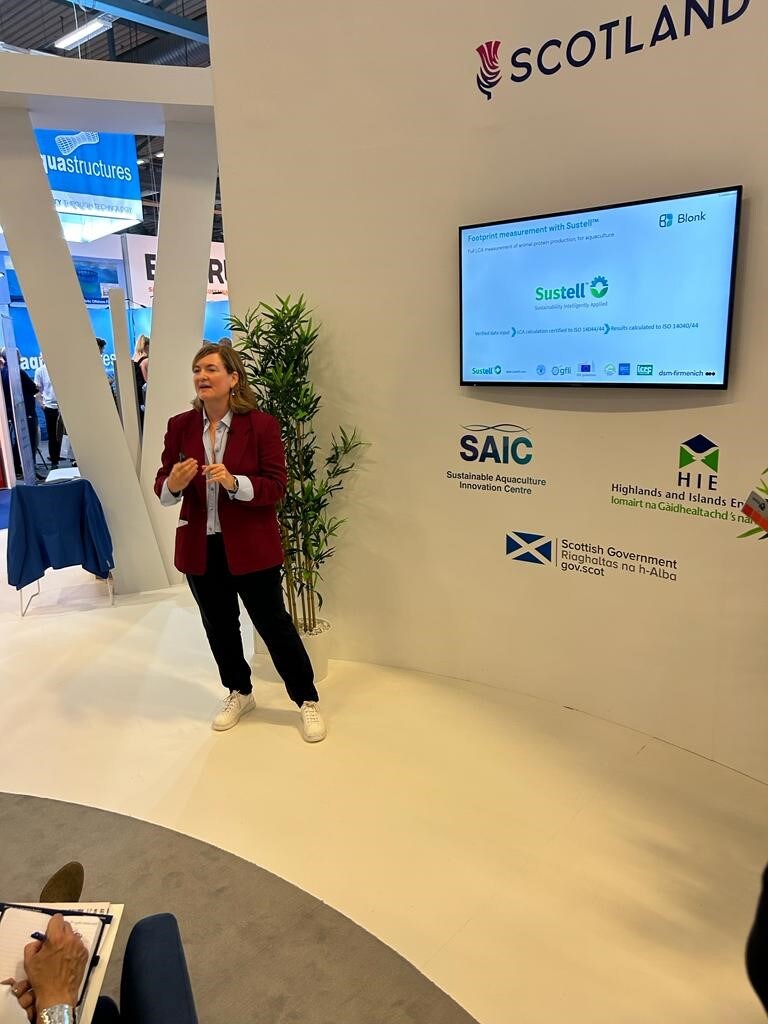 Louise Buttle presenting dsm-firmenich and Sustell at Aqua Nor 2023 in the Scottish Pavilion